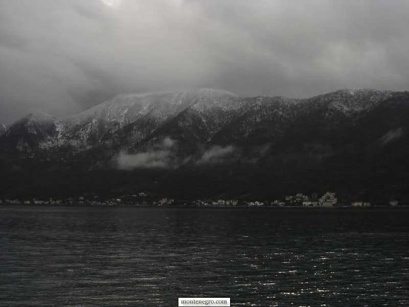 Winter light over Prčanj houses and the quiet bay shore