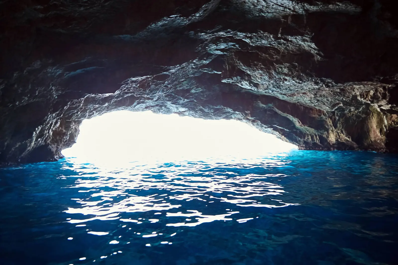 Sunlit blue water inside the Blue Cave on Luštica