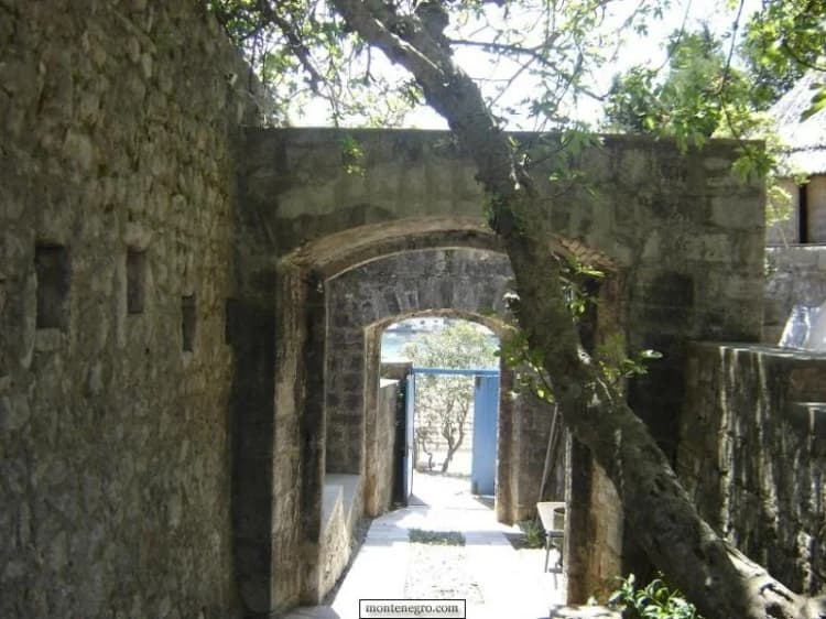 Arched stone passage at the Forte Rose complex