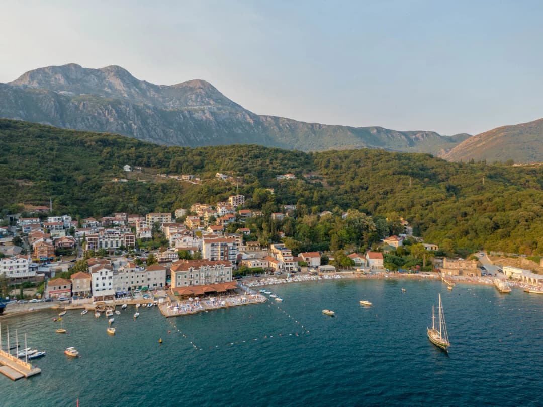 Aerial view of Meljine bay, beach and village under the mountains