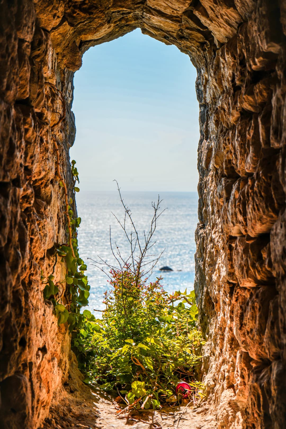 A stone embrasure in Ulcinj's fortress walls framing the open sea