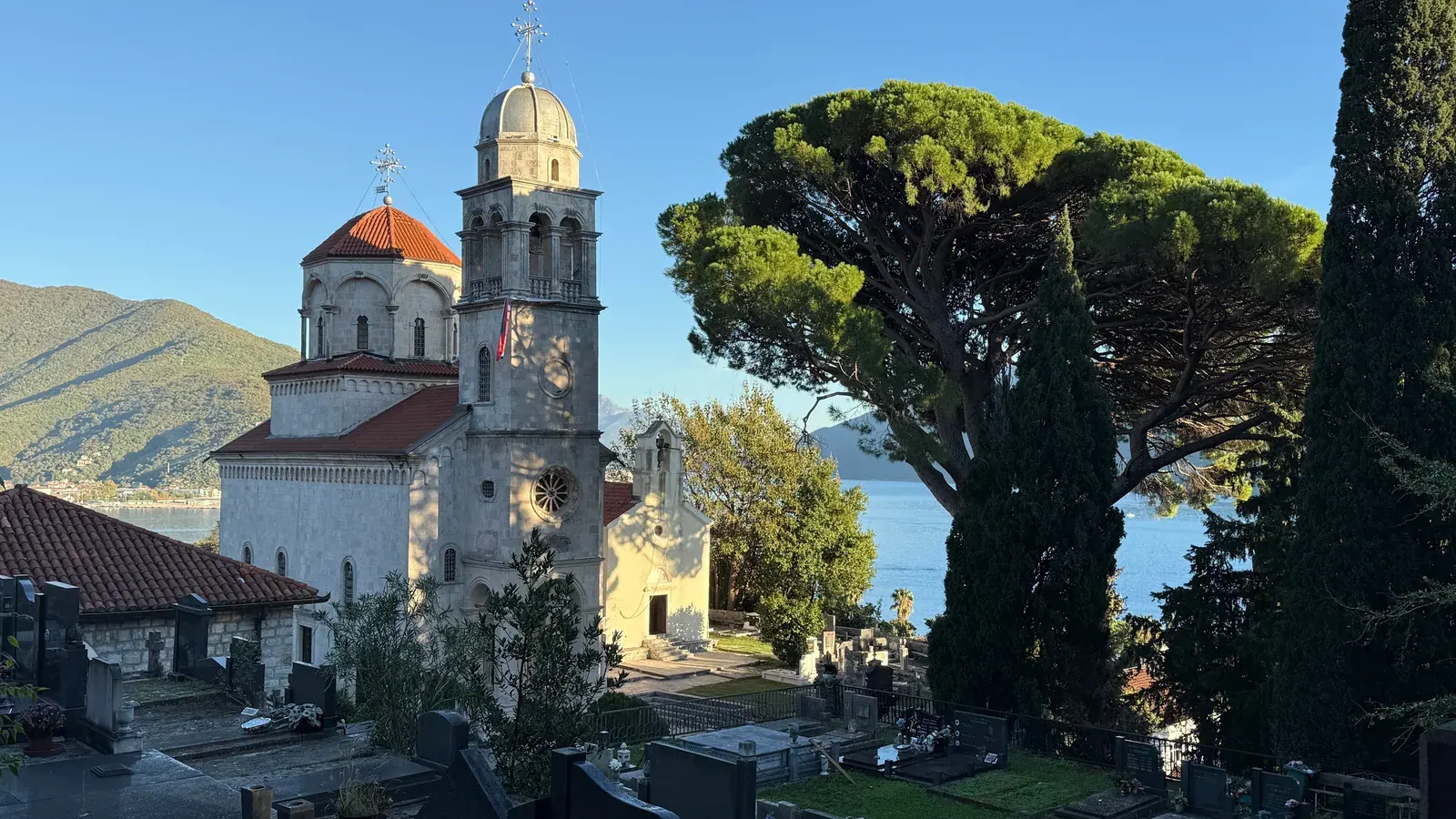 The Savina Monastery above the Bay of Kotor near Herceg Novi, framed by pines and cypress