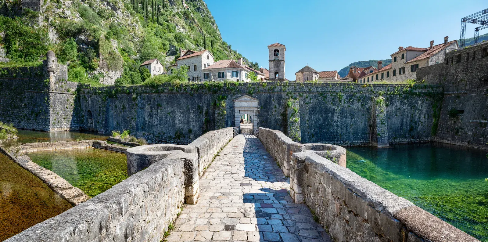 Stone bridge across the moat to the River Gate of Kotor's Old Town walls